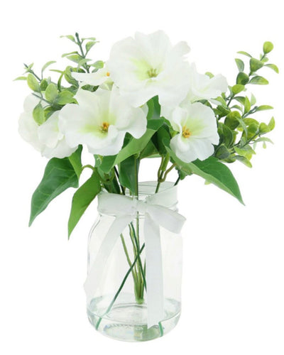 White Pansy Arrangement In Glass Ribbed Vase