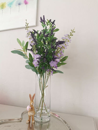 Lavender And Stock Floral Arrangement In Tall Glass Vase